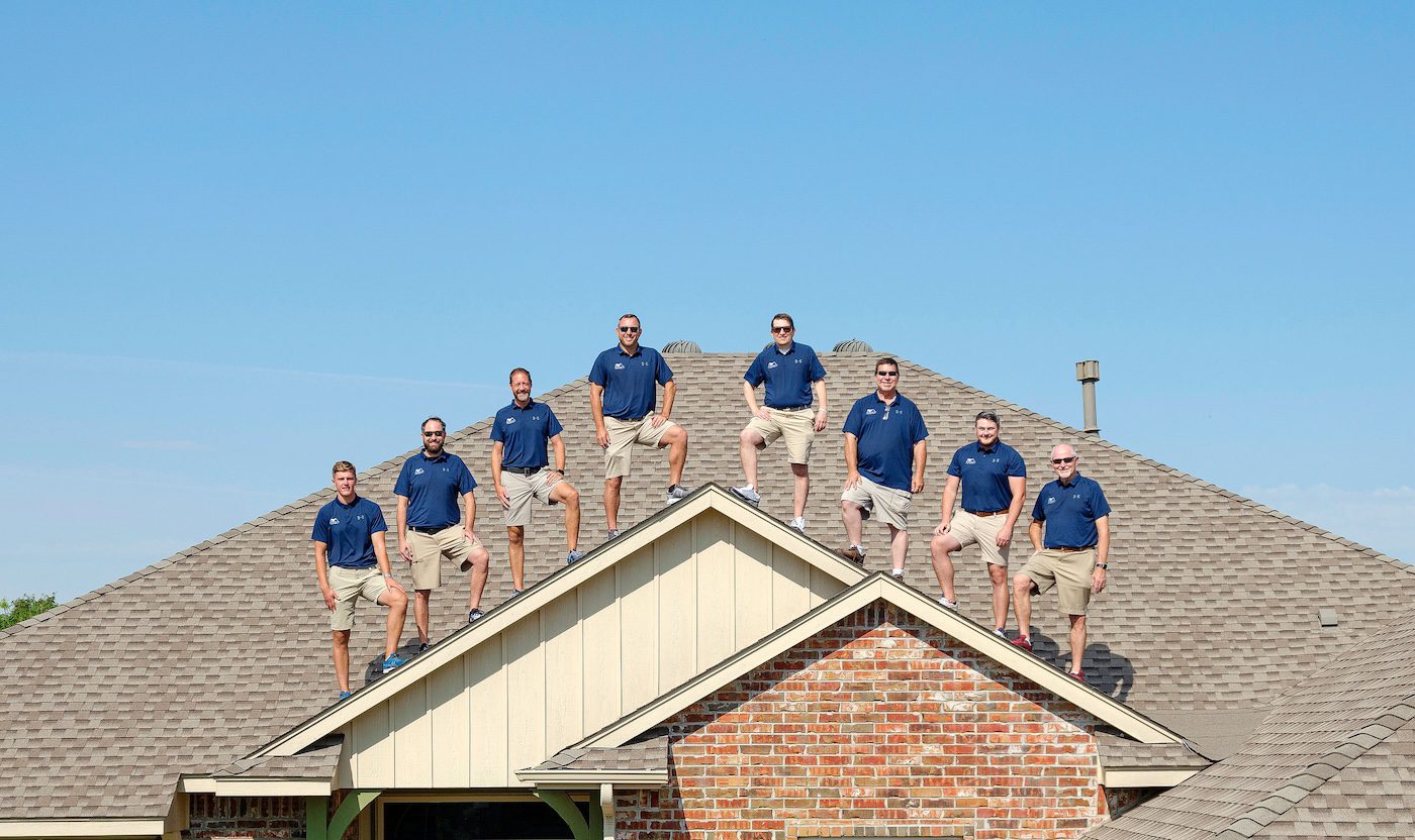 All American Roofing contractor team on a house roof in okc